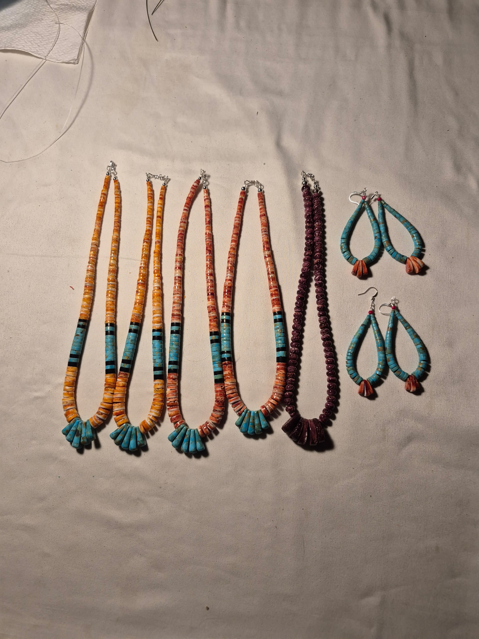 Multiple necklaces and earrings